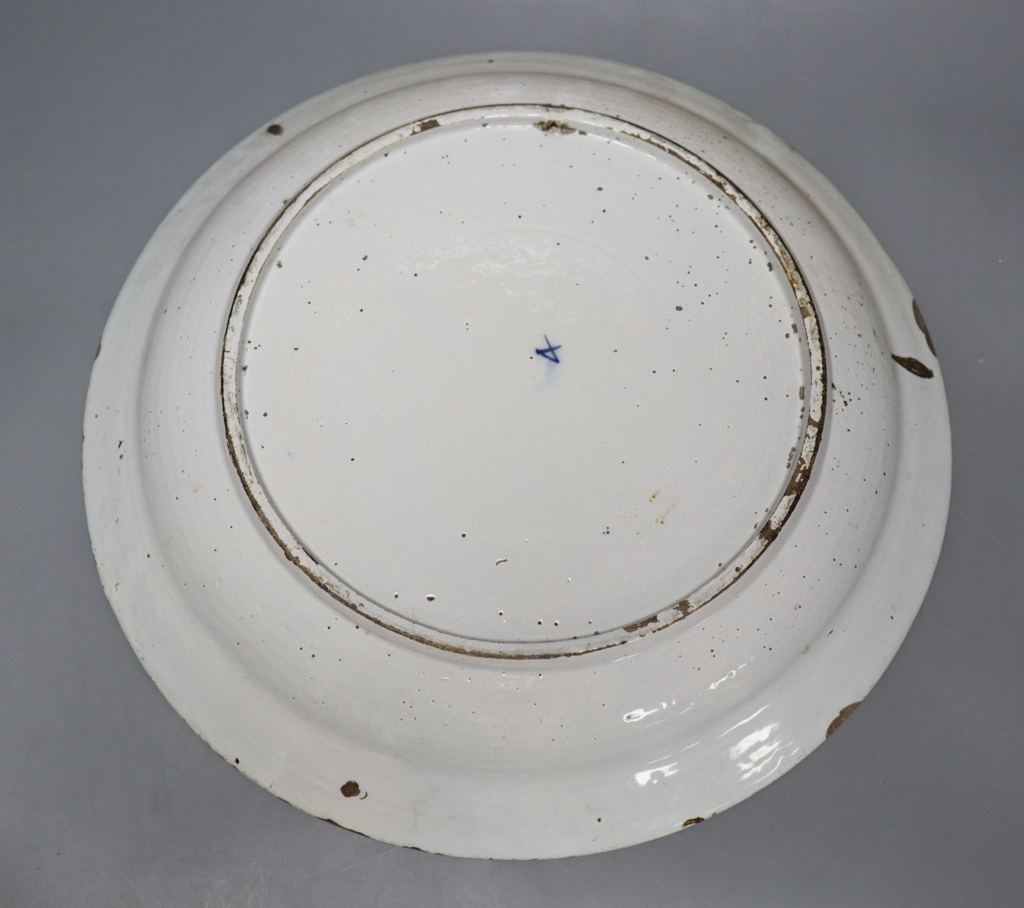 An 18th century blue and white Delft charger, 35cm